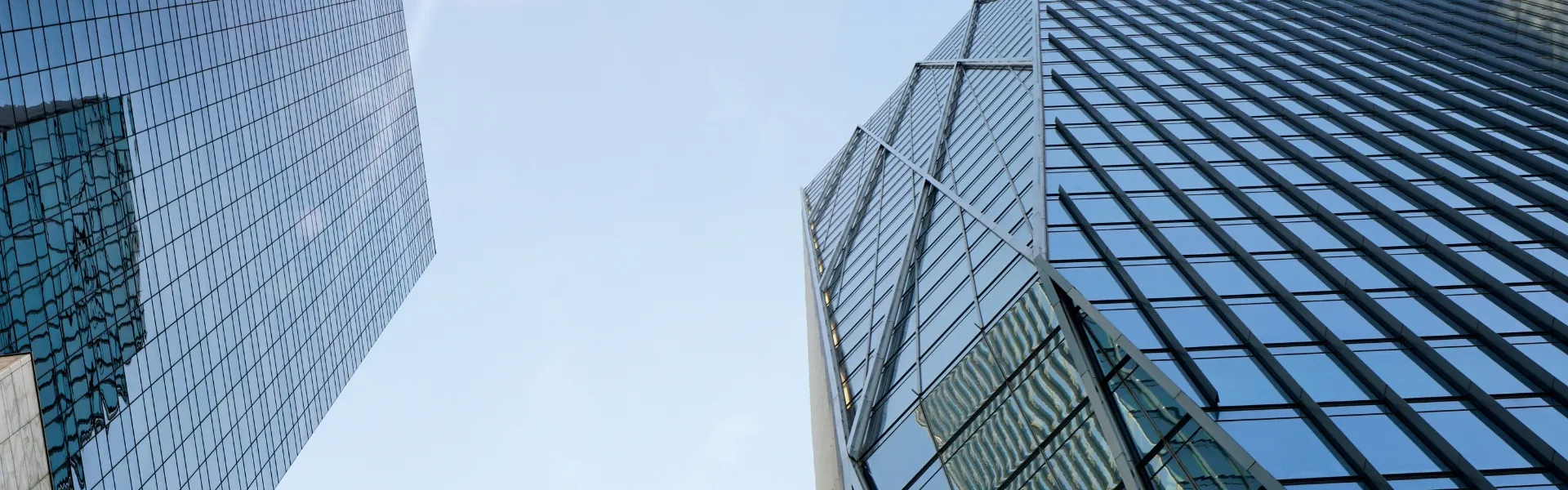 Modern glass skyscrapers representing industry leadership